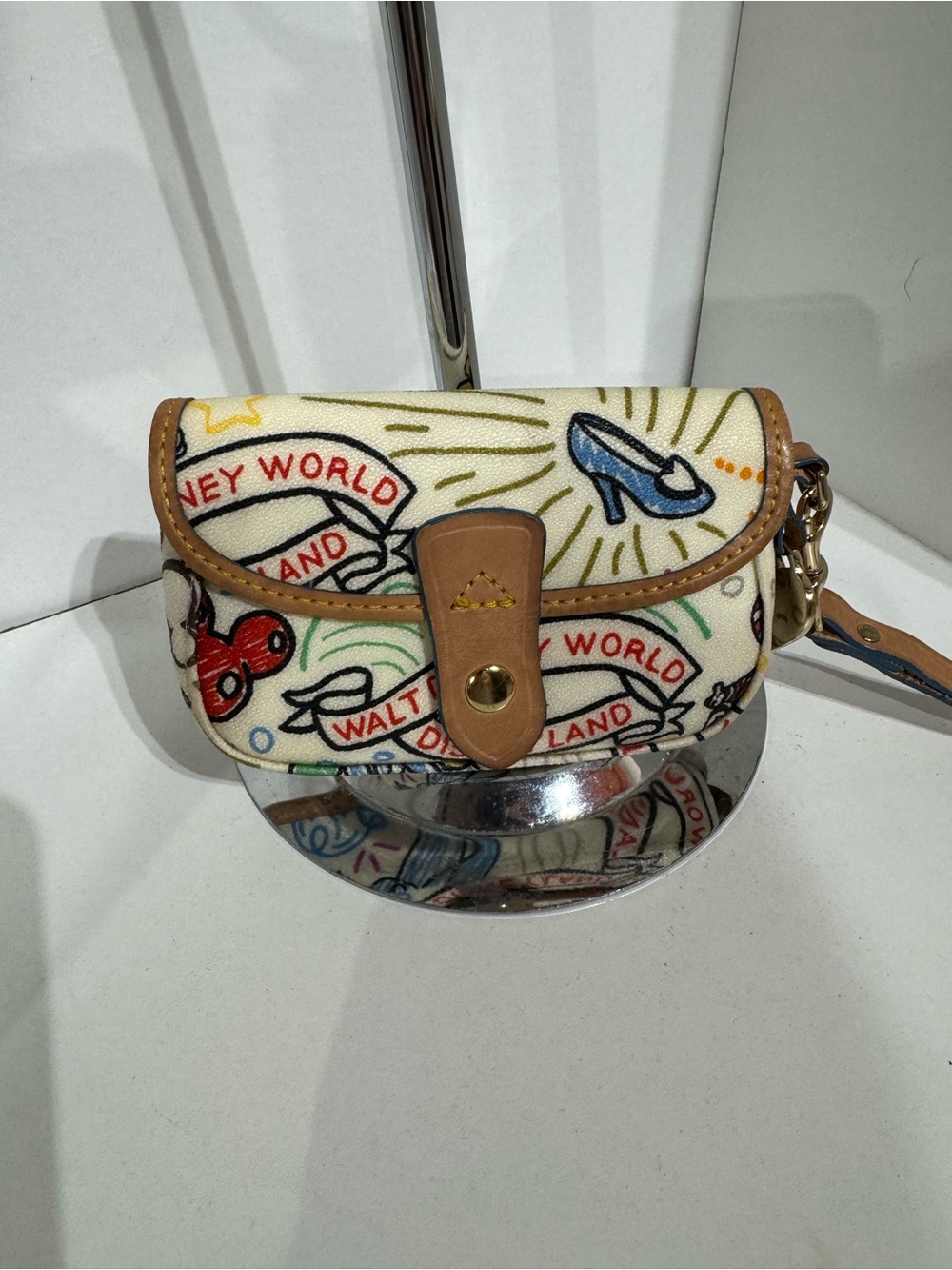 Dooney & Bourke Disney Cream Canvas Wristlet with Multicolor Motifs